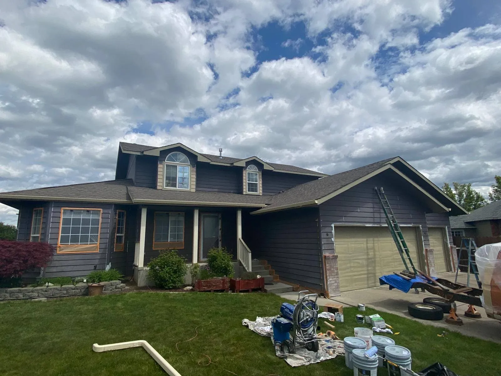 Fully repainted single-story home exterior with matching color-consistent siding